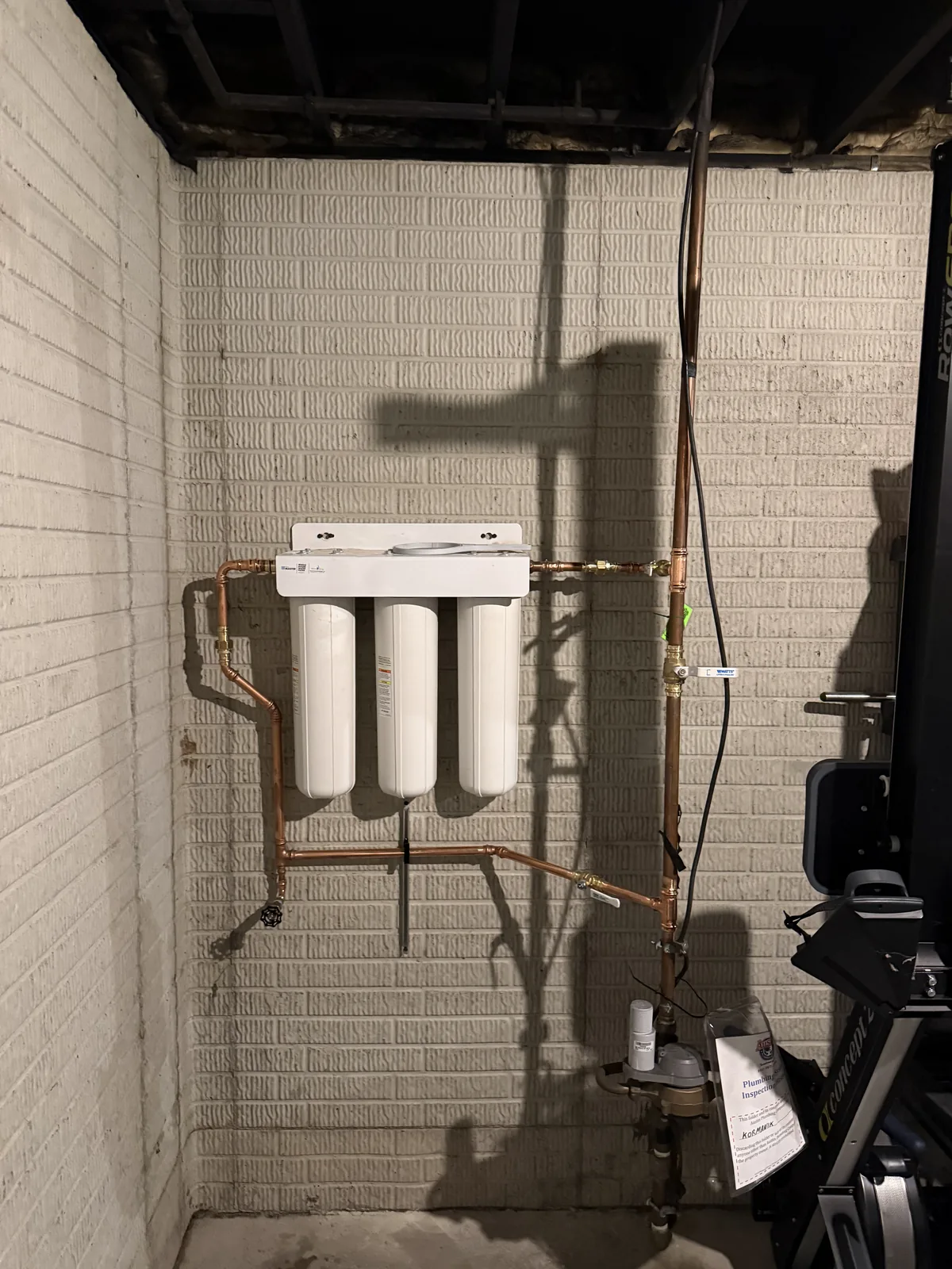 Three-stage whole-house water filter plumbed in copper